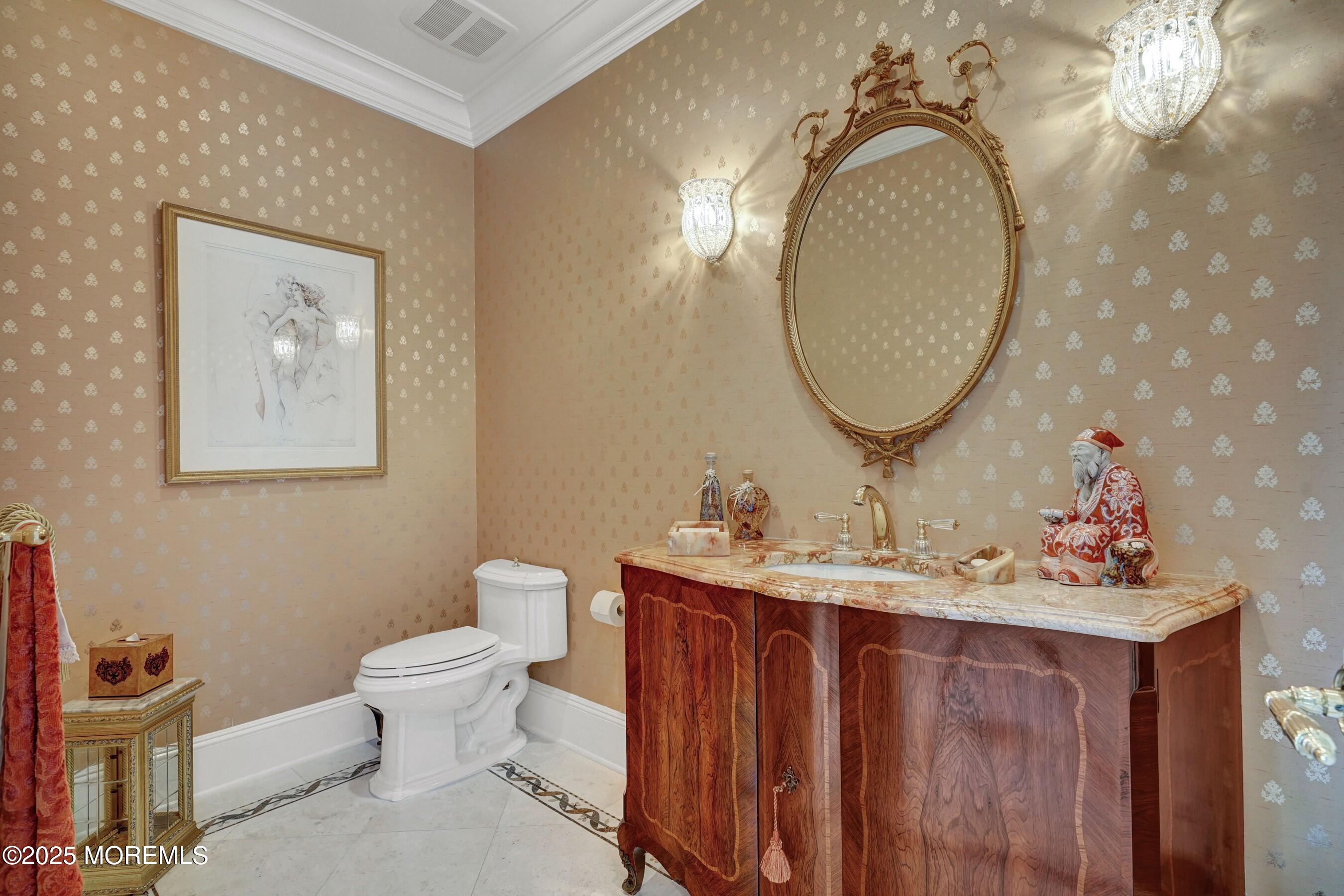 1015 Forrest Road Brielle, NJ 08730 - Photo 31 of 61 a bathroom with a toilet a sink and mirror