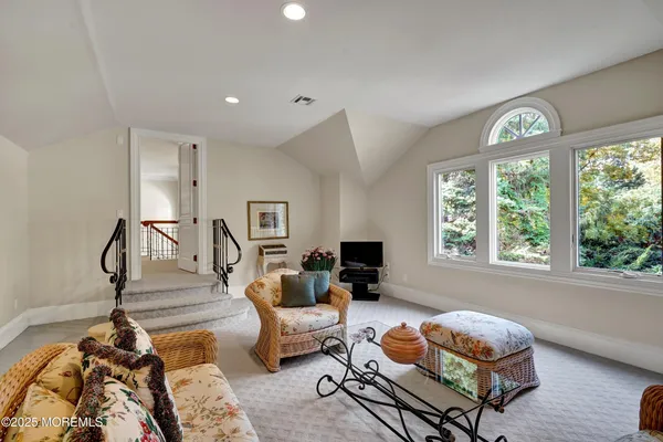 a spacious bathroom with double sink and a mirror