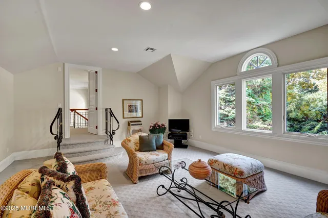 a spacious bathroom with double sink and a mirror