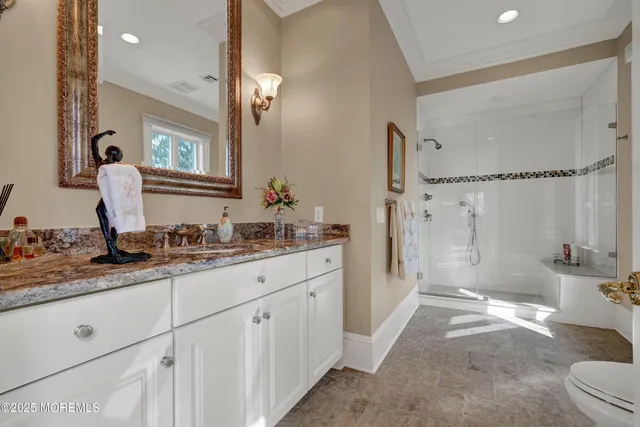 a kitchen with white cabinets a sink a window and appliances