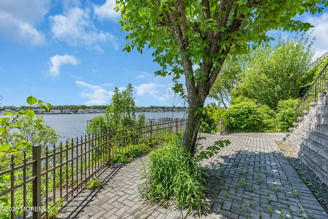 a view of outdoor space with garden and trees