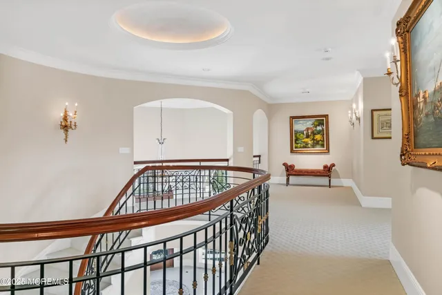 a view of residential houses with yard and ocean view