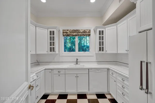 an aerial view of a houses with a yard