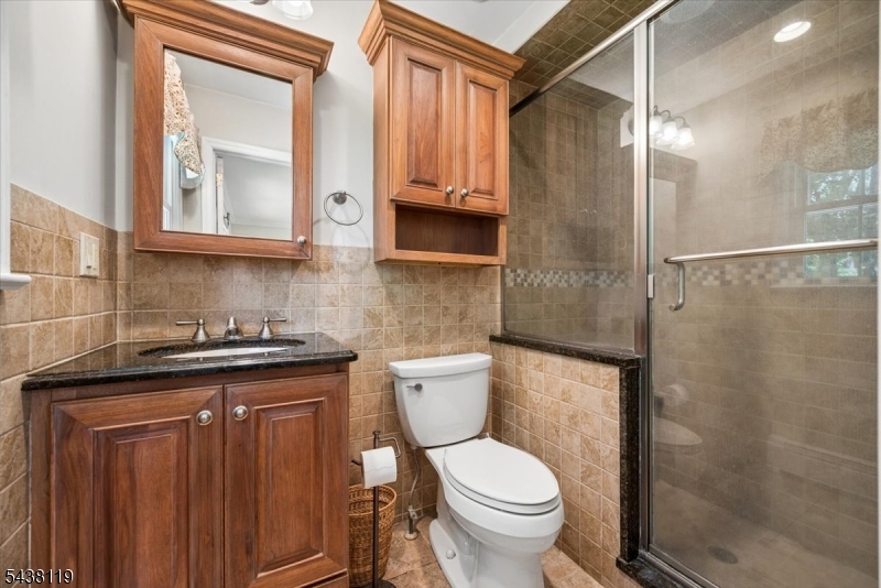 335 Drakestown Road Long Valley, NJ 07853 - Photo 19 of 34 a bathroom with a granite countertop sink toilet and shower