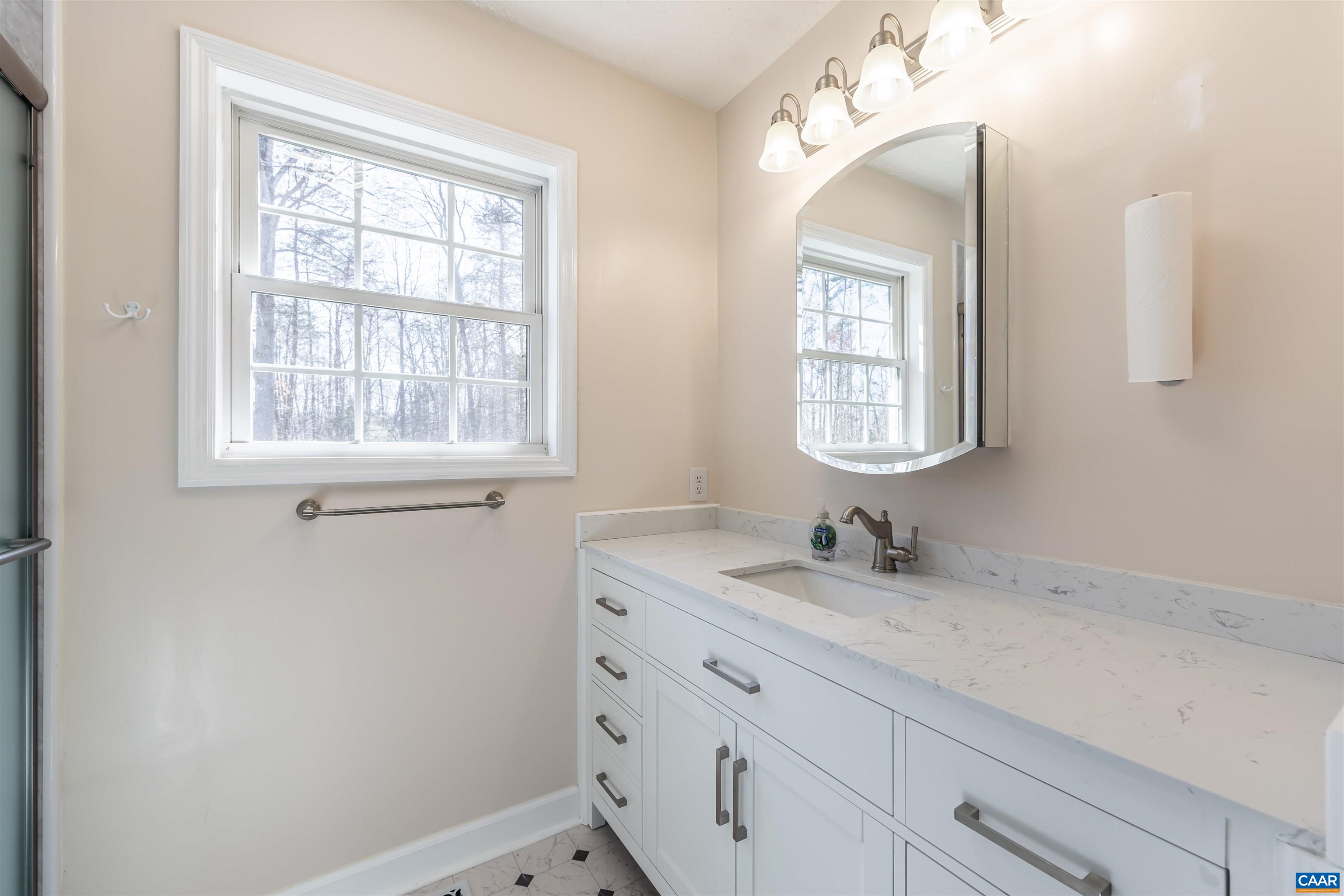 242 Fairview Road Louisa, VA 23093 - Photo 32 of 75 a bathroom with a sink and a mirror