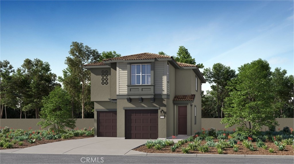 1166 Thunderchief Lane Rialto, CA 92376 - Photo 14 of 16 a front view of a house with a garden