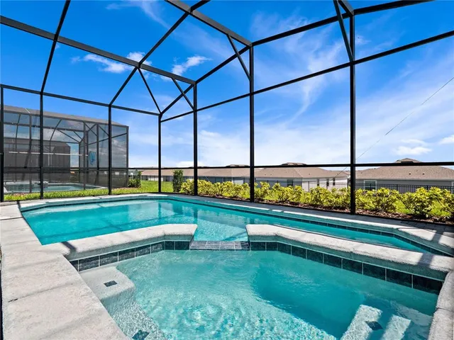 a view of swimming pool with a yard