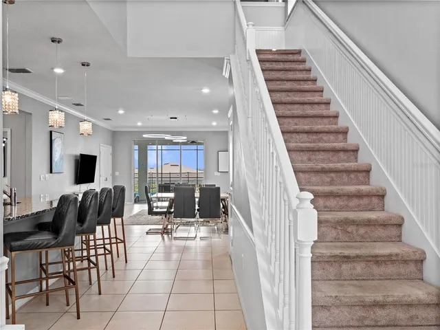 a lobby with furniture and stairs