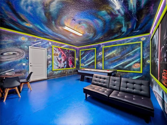 a reading room with furniture and wooden floor