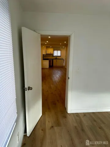 a view of a bathroom from a hallway