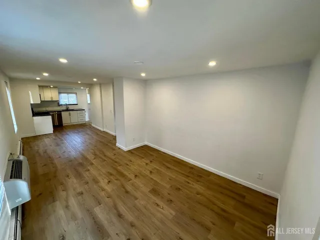a view of a kitchen with a sink and cabinets