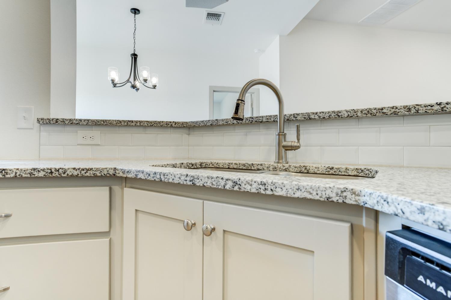 7007 18th Street Lubbock, TX 79416 - Photo 14 of 34 a close view of a faucet sink and tap