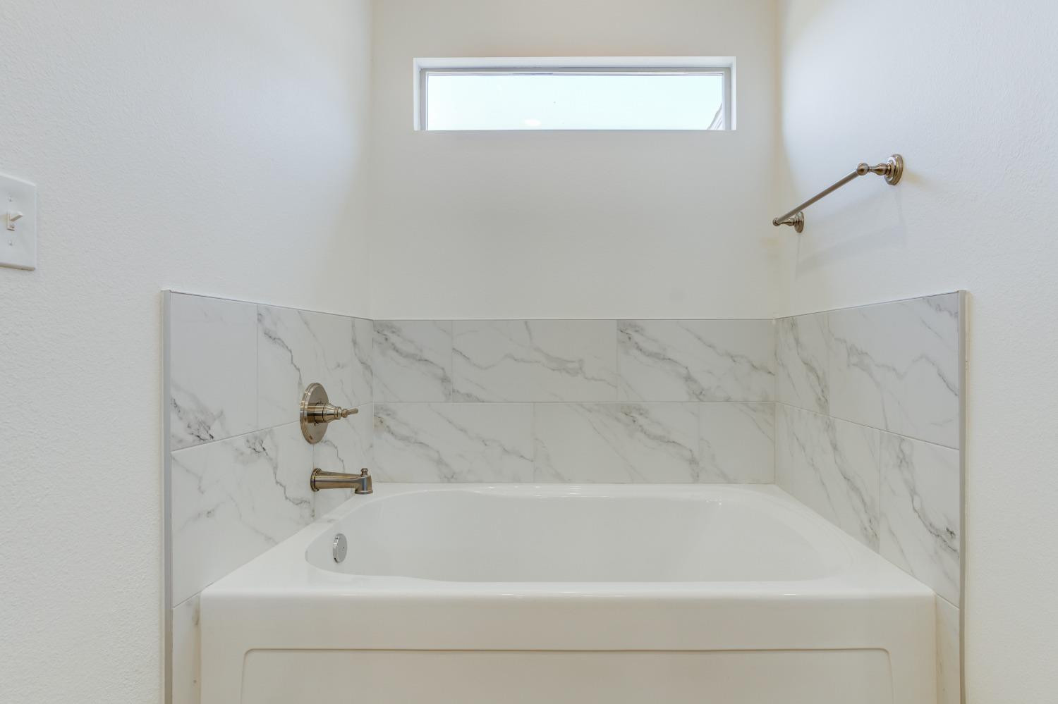 7007 18th Street Lubbock, TX 79416 - Photo 30 of 34 a bathroom with a bathtub