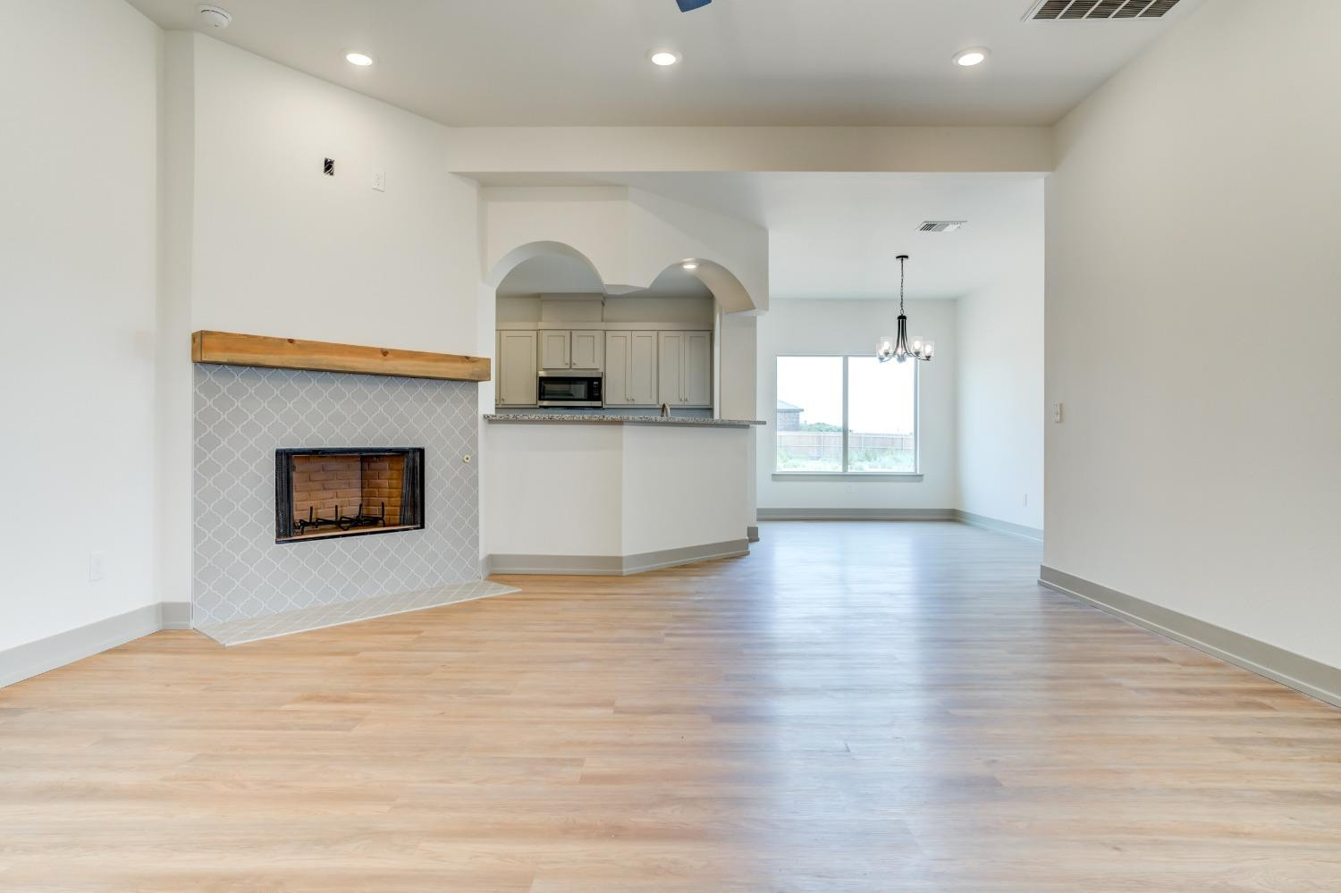 7007 18th Street Lubbock, TX 79416 - Photo 6 of 34 a view of kitchen and hall with wooden floor