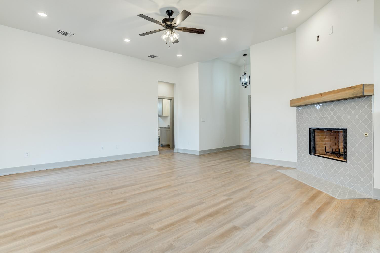 7007 18th Street Lubbock, TX 79416 - Photo 8 of 34 a view of an empty room with a window