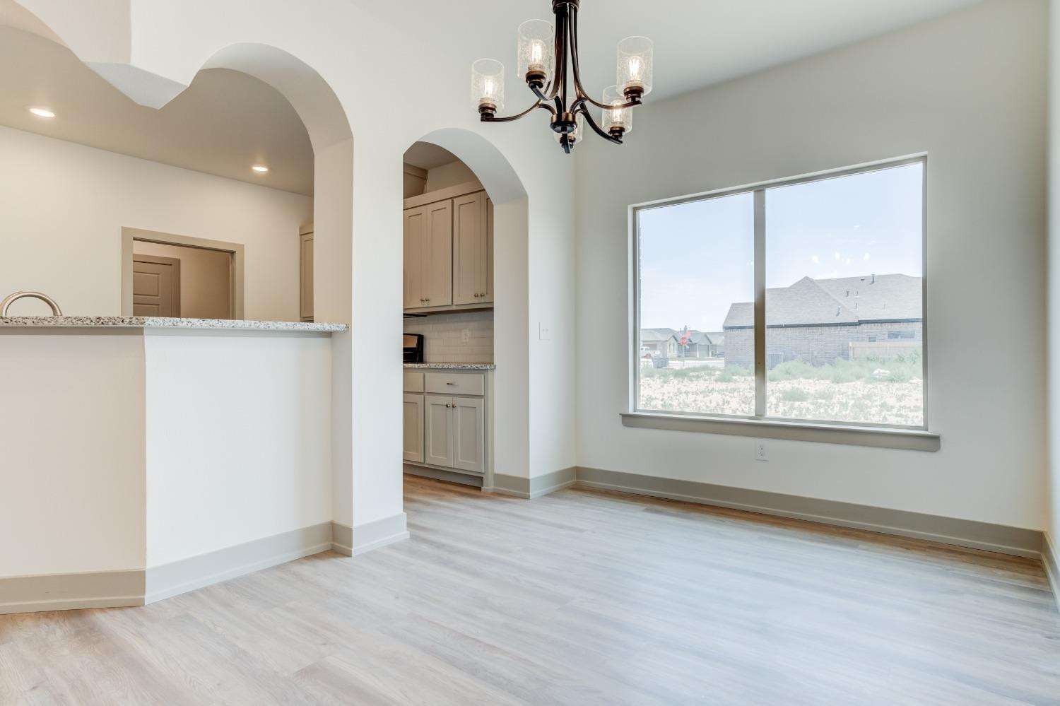 7007 18th Street Lubbock, TX 79416 - Photo 10 of 34 a view of an empty room with a window