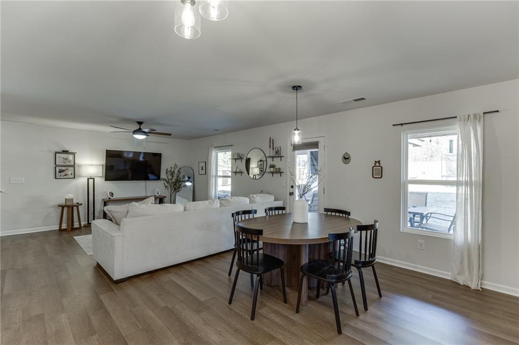 565 Bryson Trail Monroe, GA 30655 - Photo 13 of 43 a living room with furniture a flat screen tv and a window