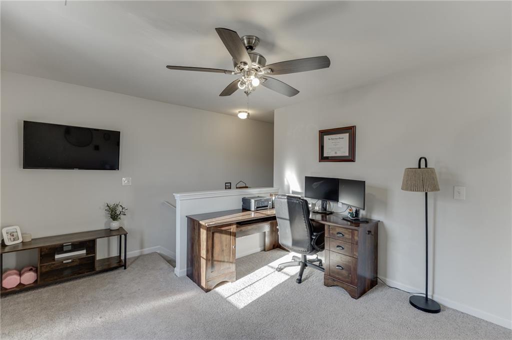 565 Bryson Trail Monroe, GA 30655 - Photo 18 of 43 a room with furniture and a flat screen tv