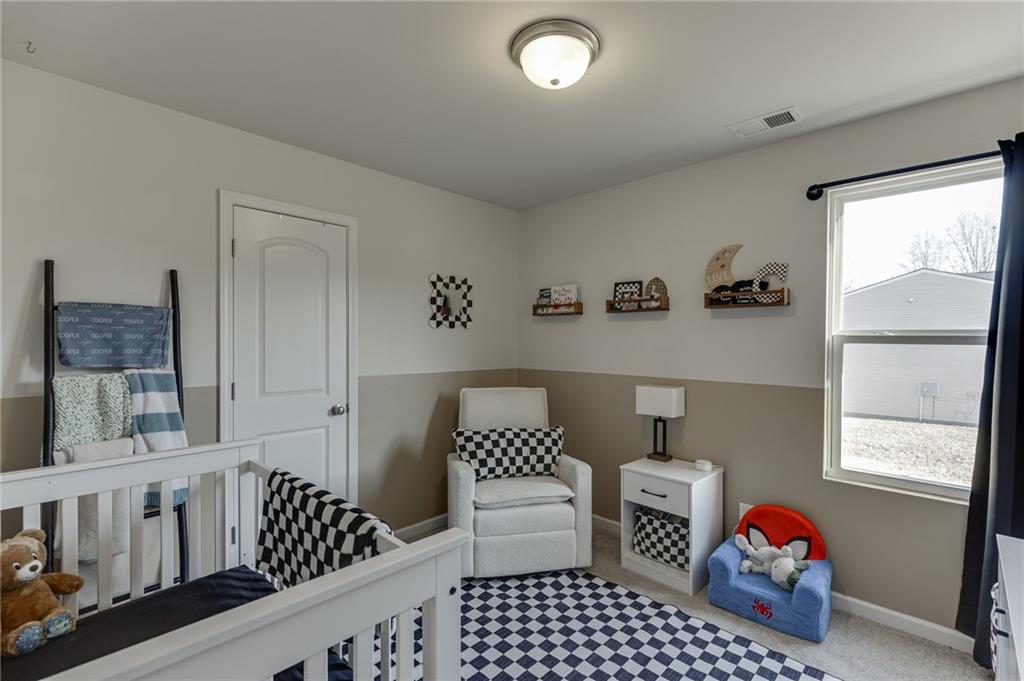 565 Bryson Trail Monroe, GA 30655 - Photo 21 of 43 a bedroom with furniture and a window