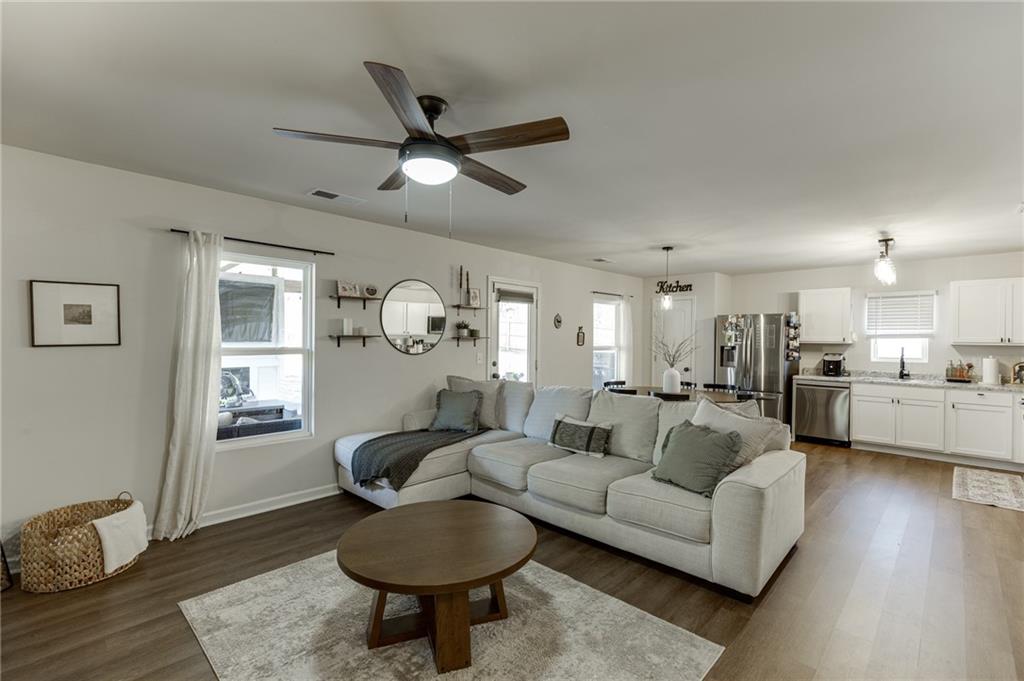 565 Bryson Trail Monroe, GA 30655 - Photo 8 of 43 a living room with furniture and kitchen view
