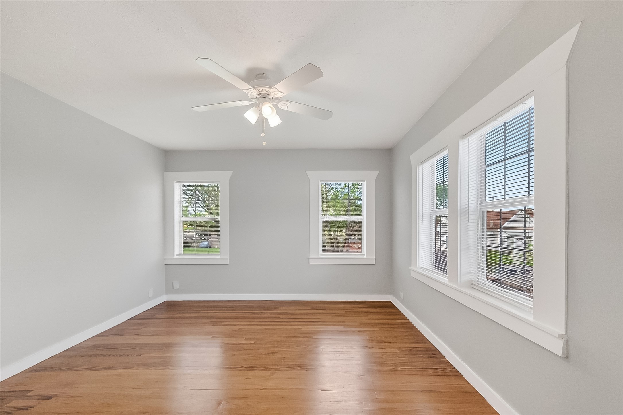 2316 Freeman Street, Unit 6 Houston, TX 77009 - Photo 17 of 25 a view of an empty room with a window and wooden floor