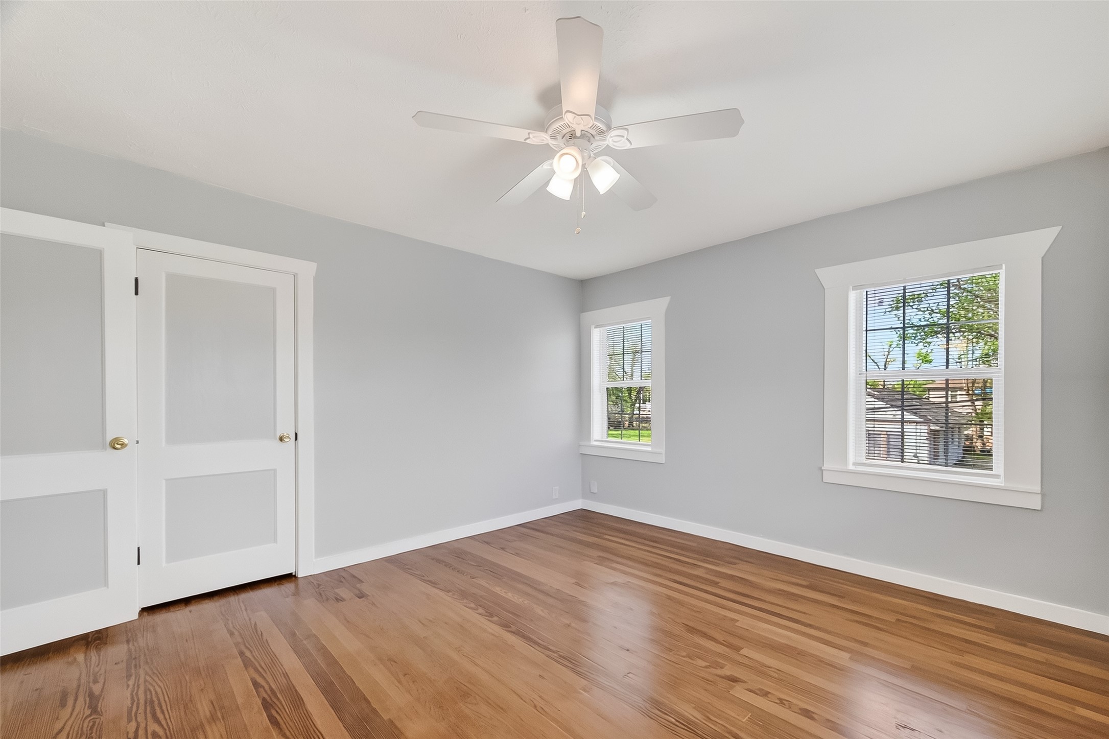 2316 Freeman Street, Unit 6 Houston, TX 77009 - Photo 18 of 25 a view of an empty room with wooden floor and a window