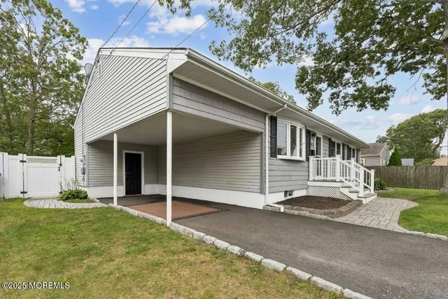 a view of house with yard