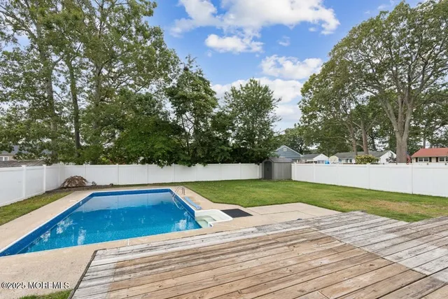 a view of swimming pool with trees
