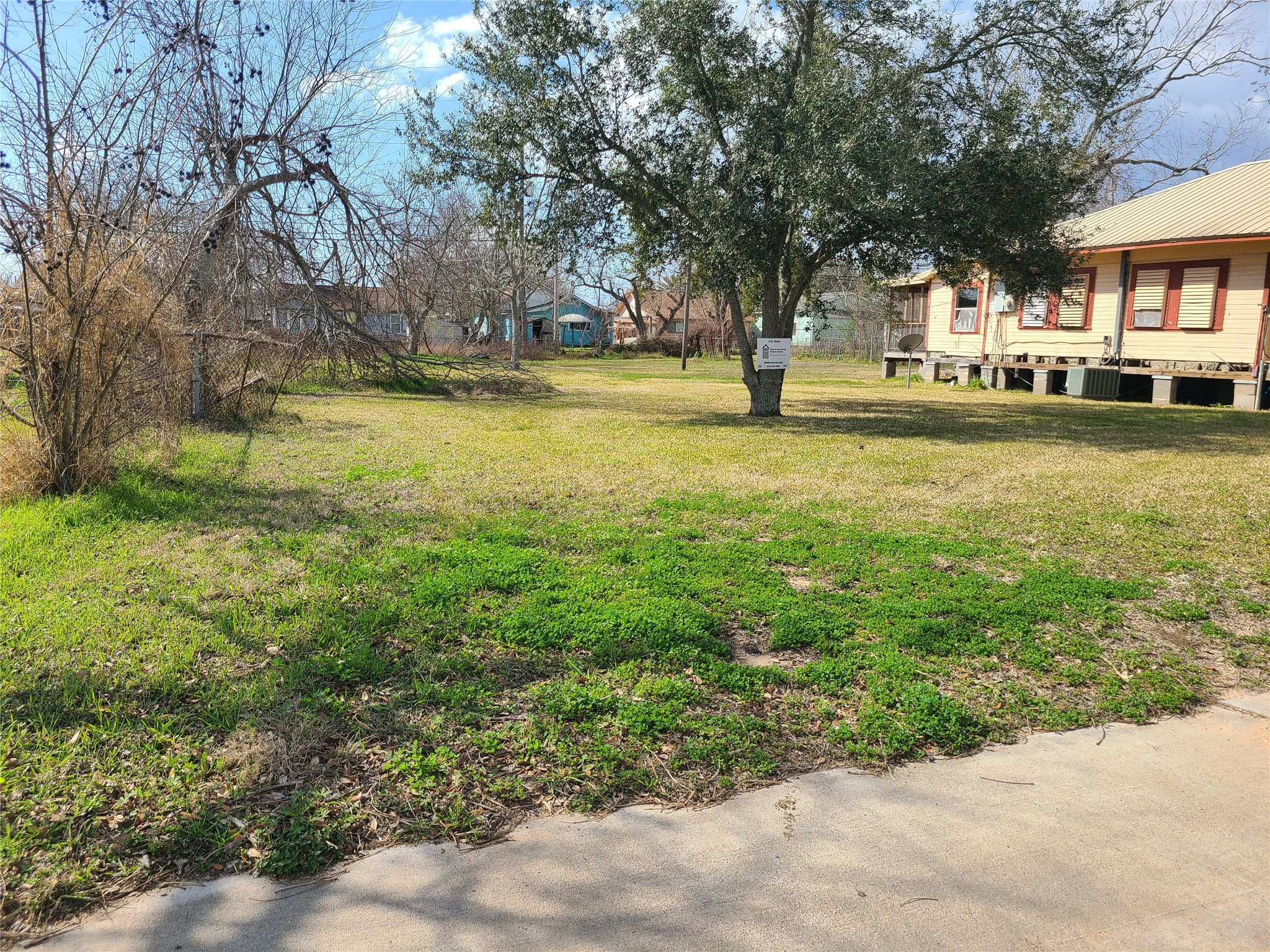 0 West Broad Street Freeport, TX 77541 - Photo 2 of 7 a view of a swimming pool with lawn chairs and plants