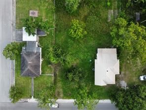 0 West Broad Street Freeport, TX 77541 - Photo 6 of 7 an aerial view of a house with outdoor space and trees all around