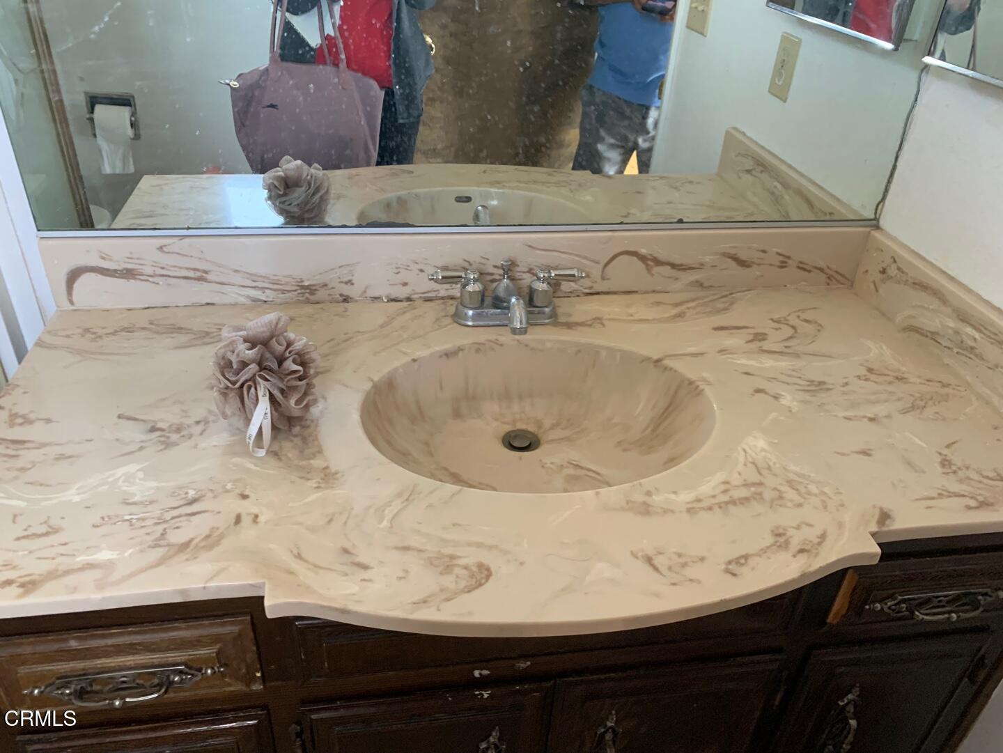 18534 Symeron Road Apple Valley, CA 92307 - Photo 4 of 10 a bathroom with a sink and a mirror