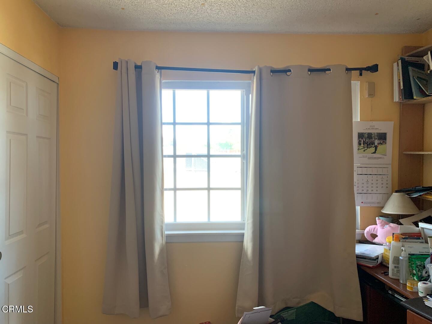 18534 Symeron Road Apple Valley, CA 92307 - Photo 6 of 10 a view of a room with a window