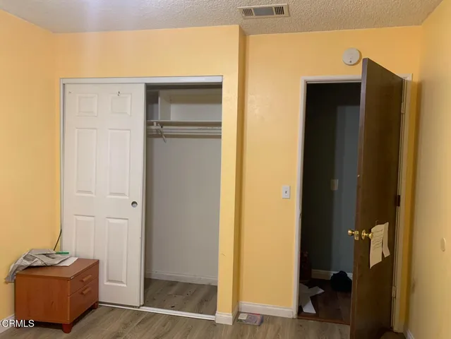 a view of room with closet and mirror