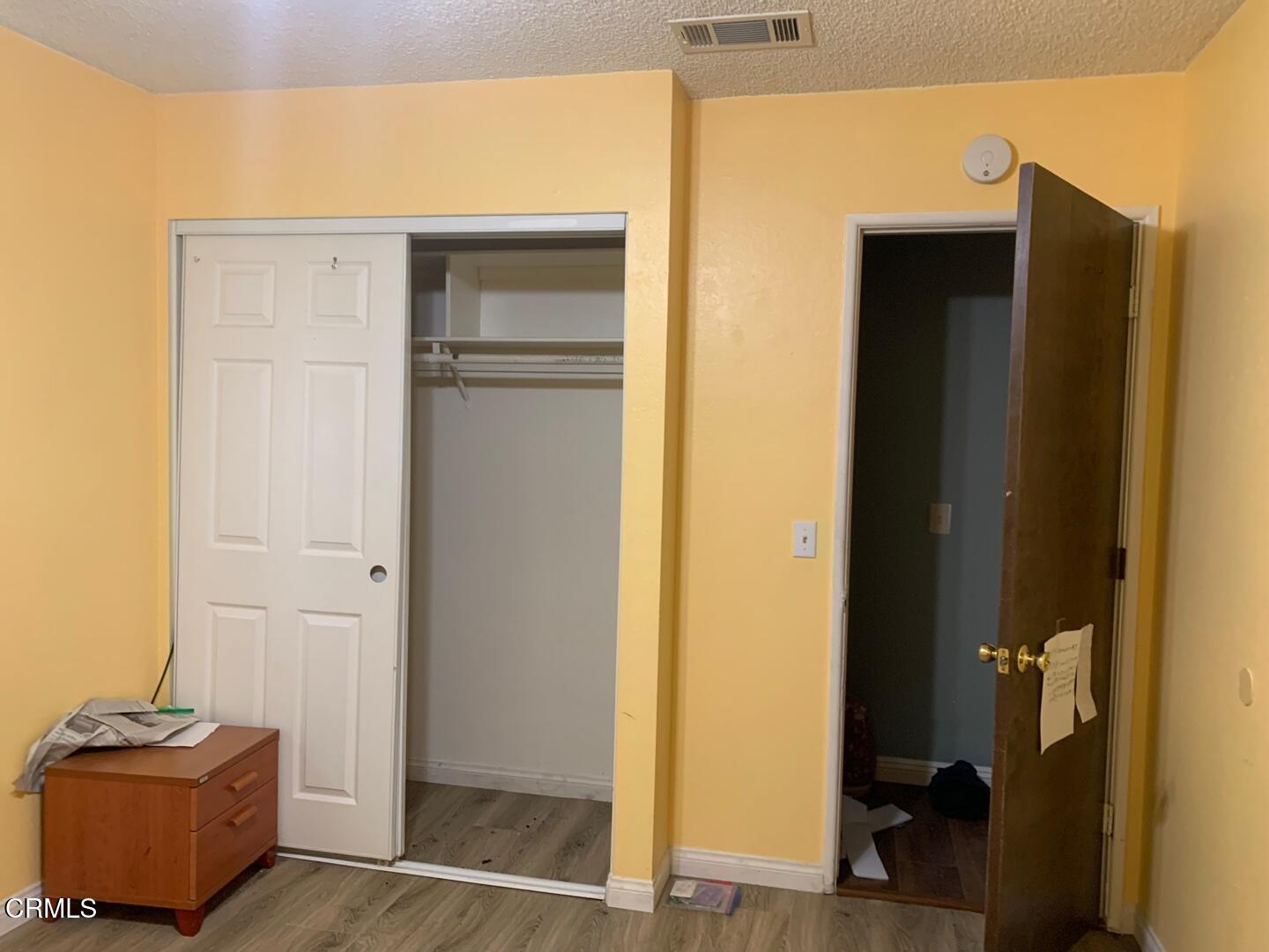18534 Symeron Road Apple Valley, CA 92307 - Photo 8 of 10 a view of room with closet and mirror