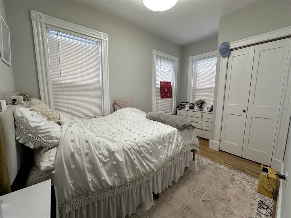 68 L Street, Unit 1 Boston, MA 02127 - Photo 12 of 12 a bedroom with a bed and a window