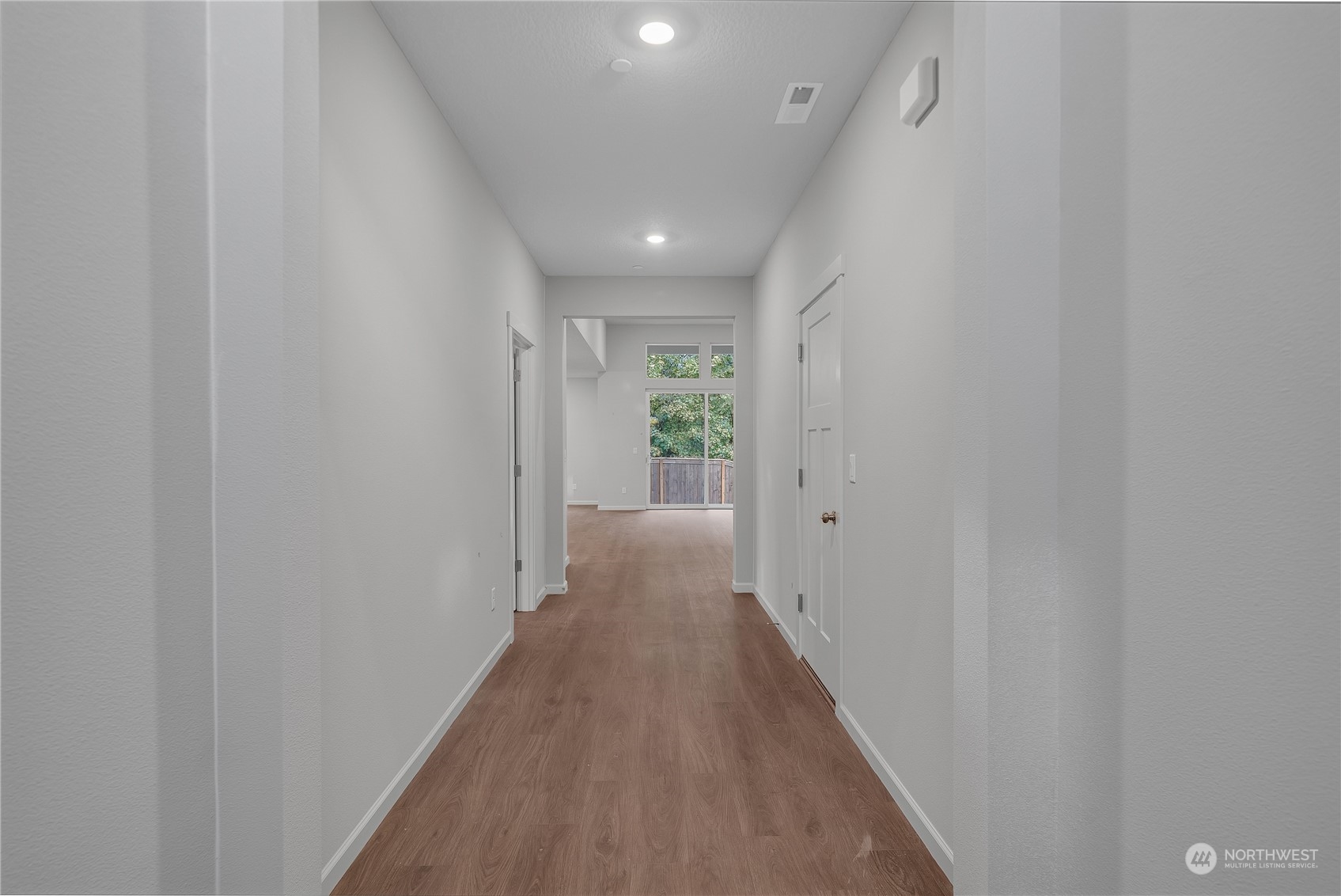 2823 South 9th Avenue Ridgefield, WA 98642 - Photo 6 of 24 a view of a hallway with wooden floor and a window