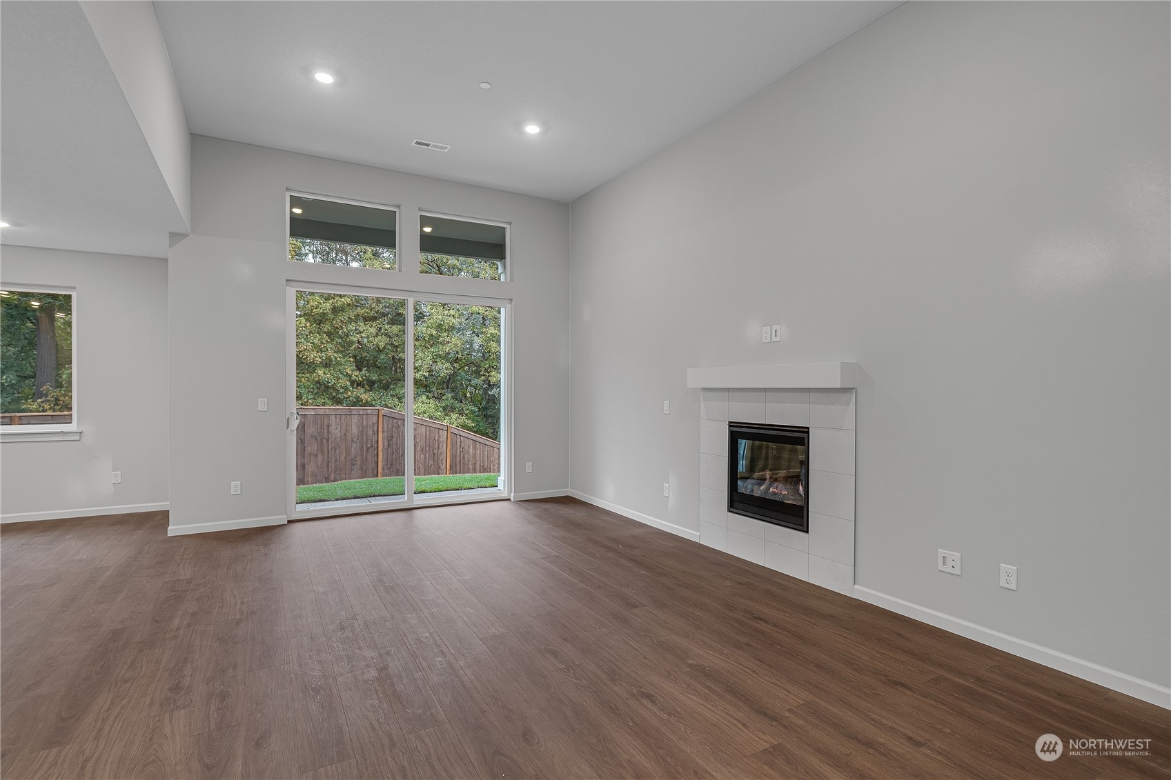 2823 South 9th Avenue Ridgefield, WA 98642 - Photo 7 of 24 a view of an empty room with wooden floor and a window