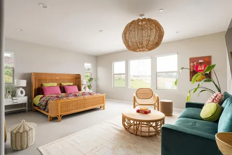 a bedroom with two beds and a large window