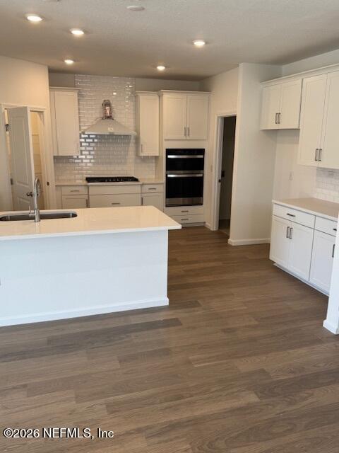 73 Chestnut Grv Road St. Augustine, FL 32092 - Photo 4 of 18 a large kitchen with stainless steel appliances kitchen island granite countertop a stove a refrigerator a sink and a oven with wooden floor