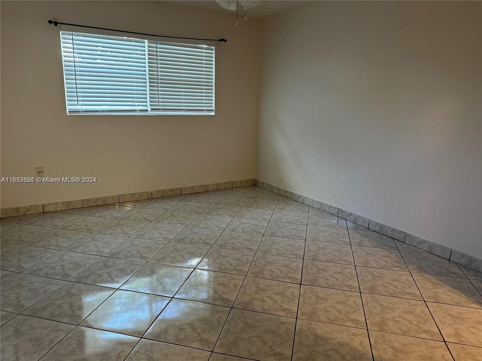 Sequoia Gardens Condominiums Deerfield Beach, FL 33441 - Photo 14 of 25 a view of an empty room with a window