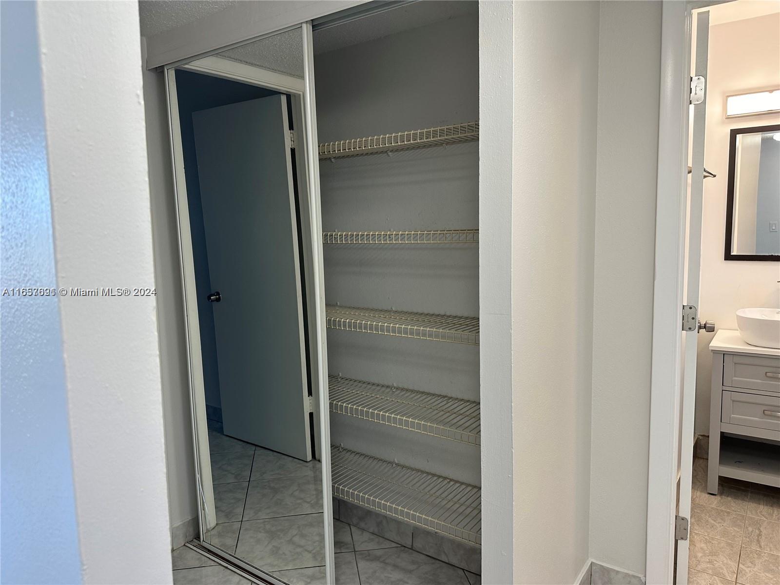 Sequoia Gardens Condominiums Deerfield Beach, FL 33441 - Photo 19 of 25 a view of closet area