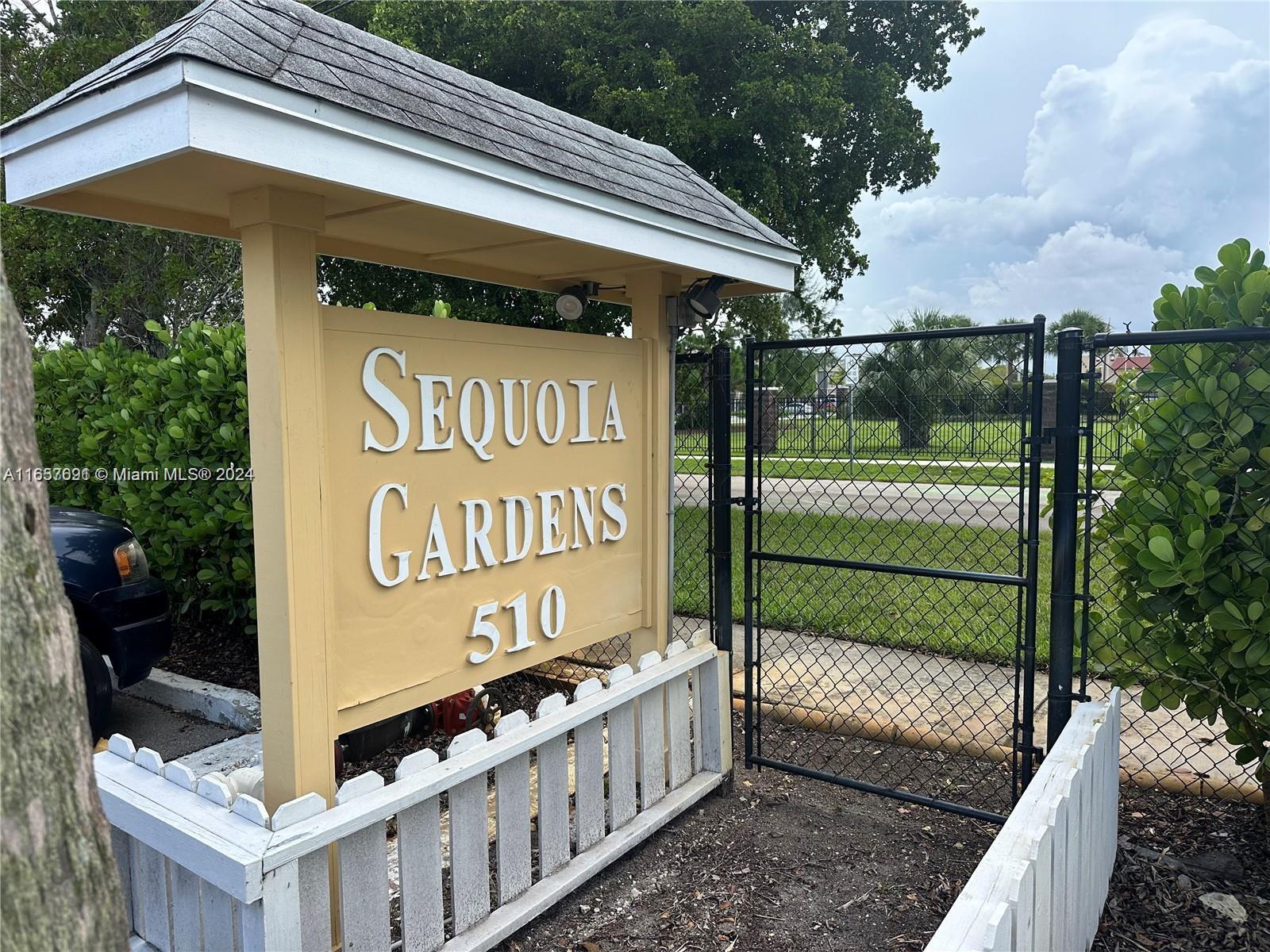 Sequoia Gardens Condominiums Deerfield Beach, FL 33441 - Photo 3 of 25 a sign on the side of a building