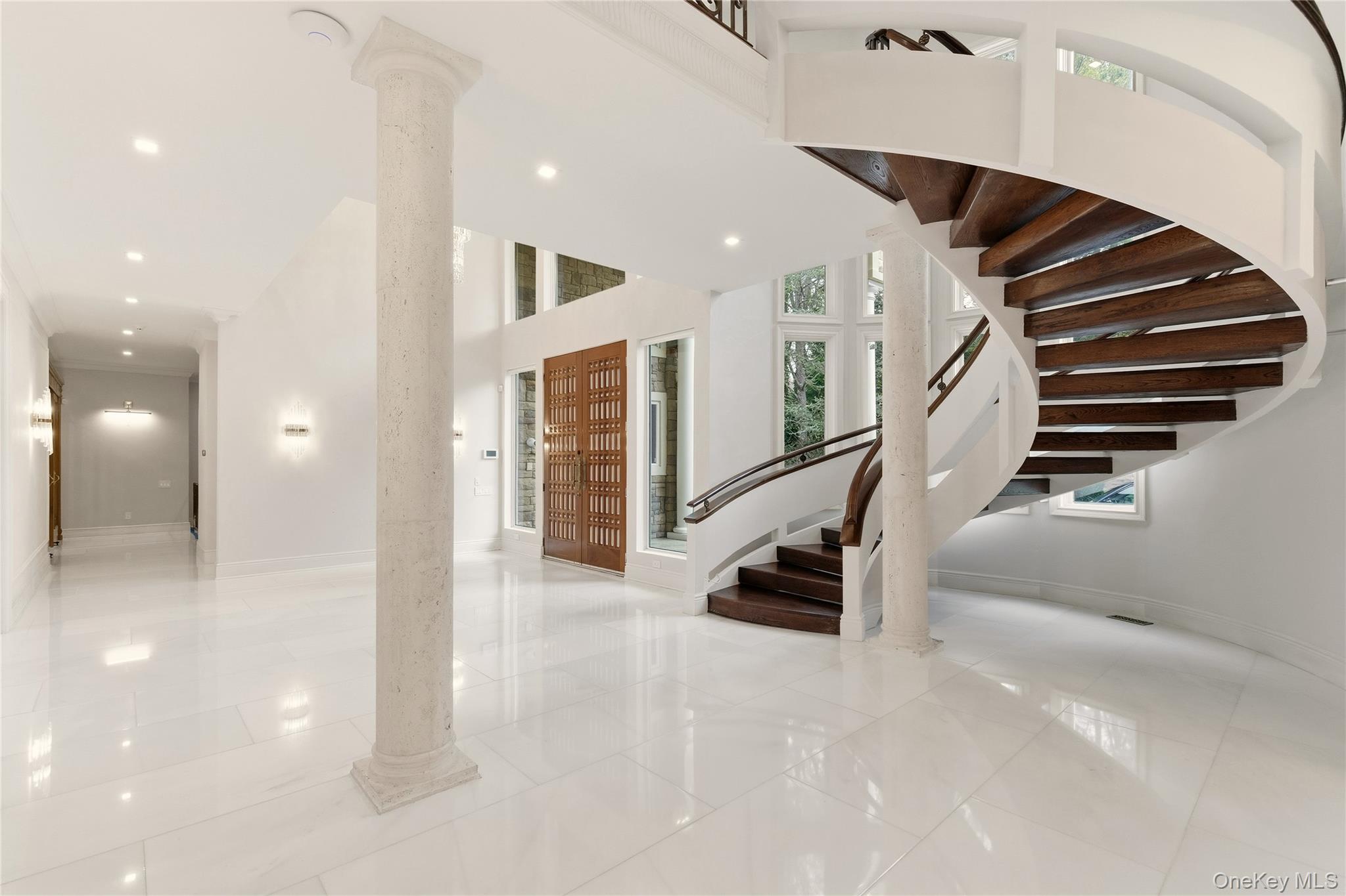 55 Coves Run Syosset, NY 11791 - Photo 3 of 50 an entryway in a hall with a front door