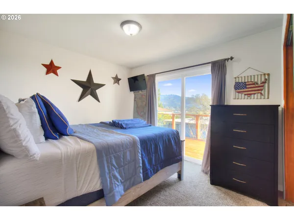 a bedroom with a bed and a dresser