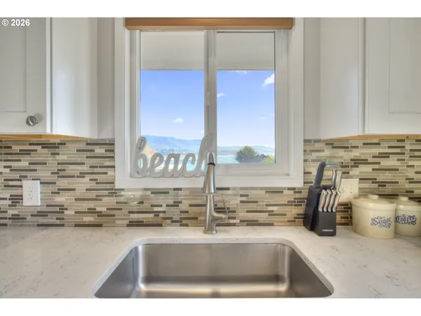 a kitchen with a sink and a window