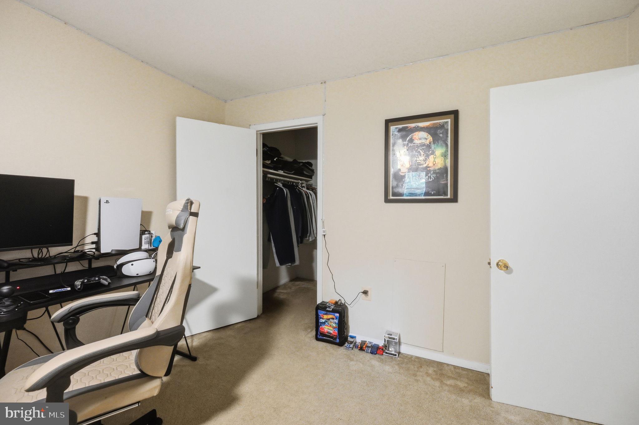 3366 Woodburn Road, Unit 23 Annandale, VA 22003 - Photo 11 of 16 a view of a workspace with furniture and a flat screen tv