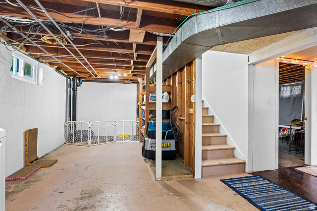 480 North 150 E Street Springville, UT 84663 - Photo 25 of 36 Unfinished basement space featuring exposed wood joists and concrete flooring, offering flexible future development opportunities