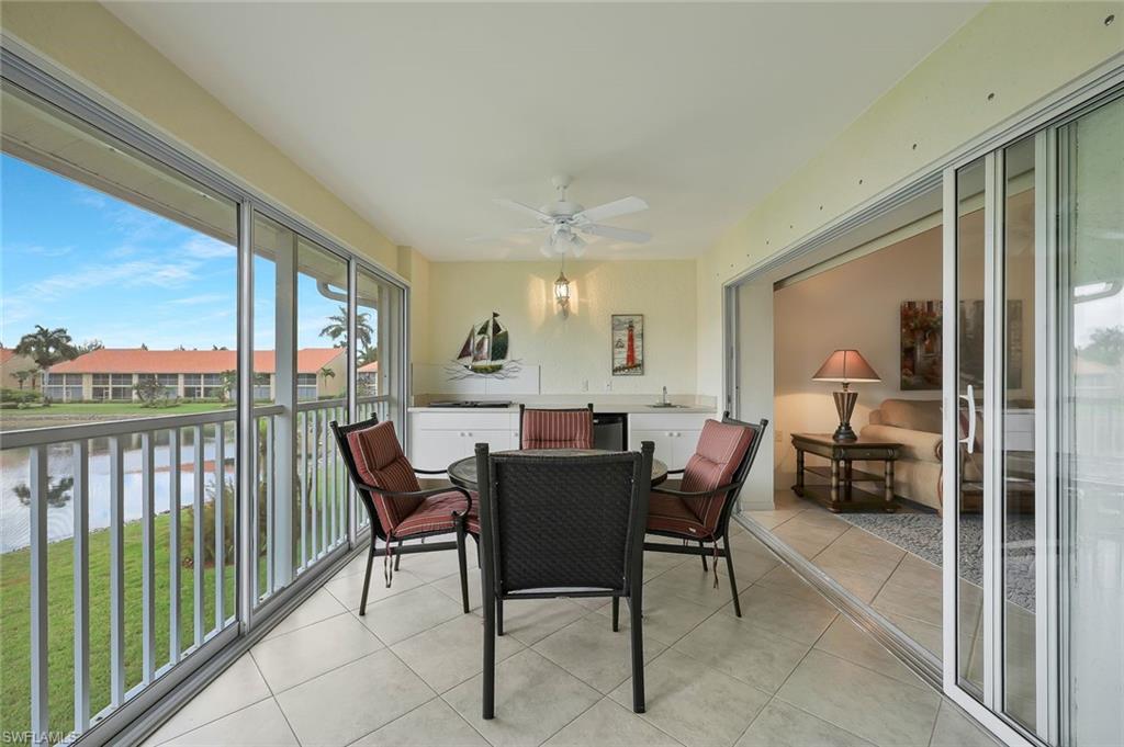 2395 Bayou Lane, Unit 7304 Naples, FL 34112 - Photo 21 of 27 LANAI WITH GLASS SLIDING DOORS FOR ALL SEASON USE
