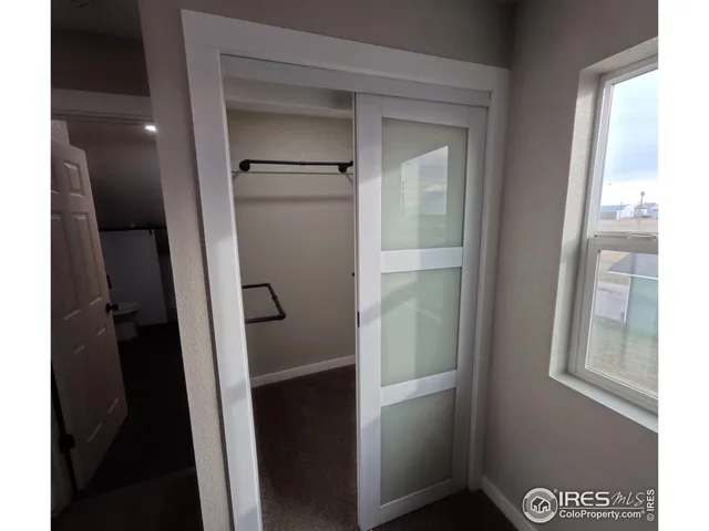 a bathroom with a shower and a mirror