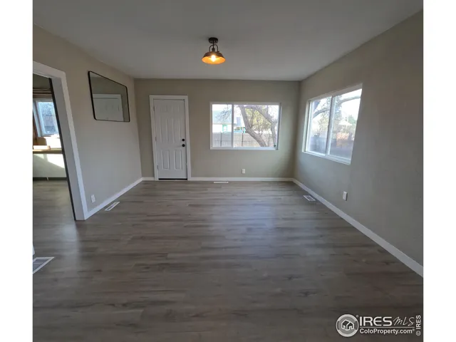 a view of an empty room and window